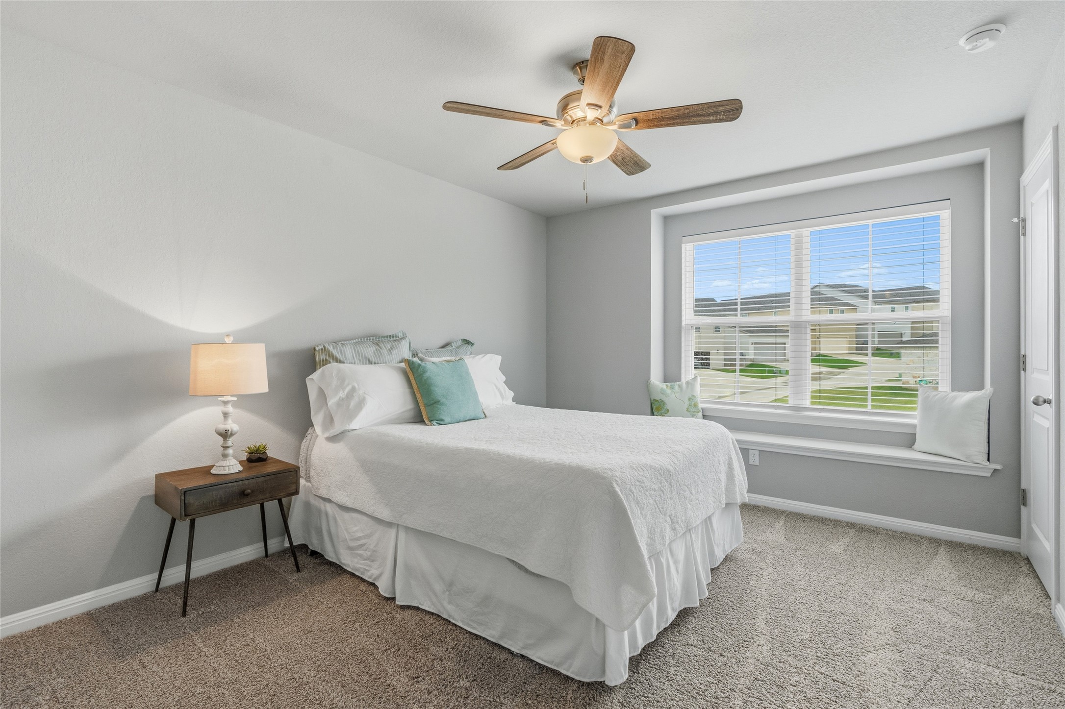 145 Beach Mountain Road Dripping Springs, TX 78620 - Photo 13 of 40 Bedroom 2 features a built in window seat perfect for reading or relaxing.