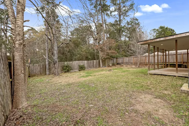 a backyard of a house with lots of green space