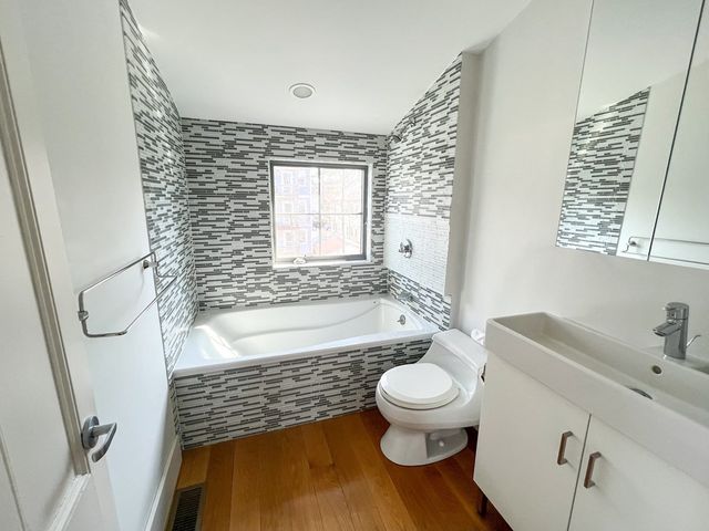 a bathroom with a sink a toilet and a bathtub