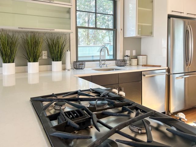 a kitchen with a stove and a sink