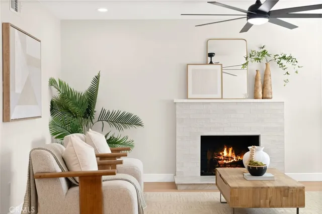 a living room with furniture and view of kitchen