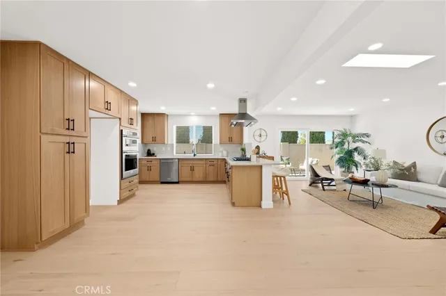 a large kitchen with a stove top oven