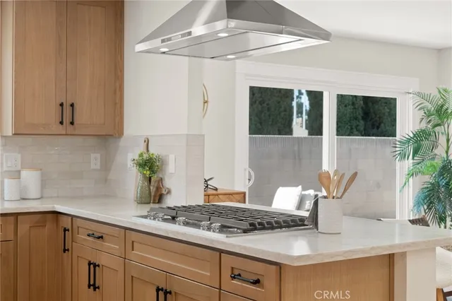 a en suite bathroom with a granite countertop sink