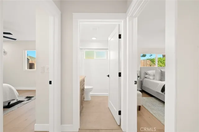 a bathroom with a granite countertop sink a mirror and a shower