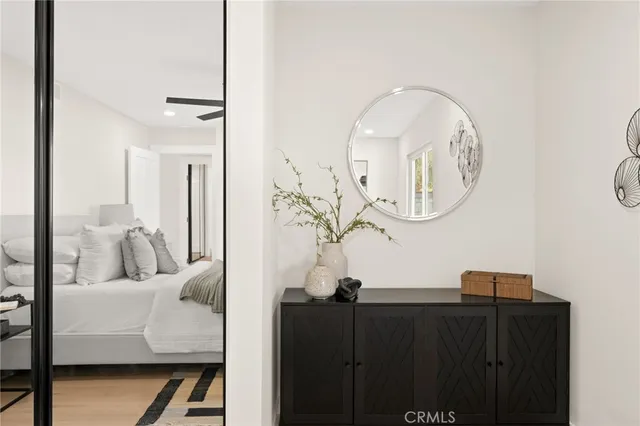 a bathroom with a granite countertop sink mirror vanity and toilet