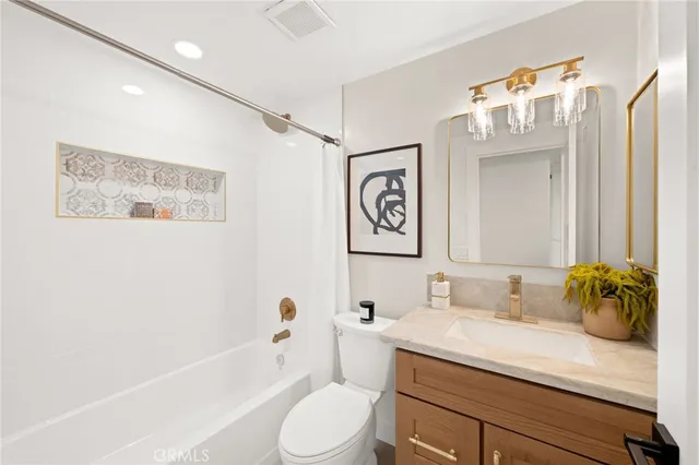 an aerial view of a house with a swimming pool