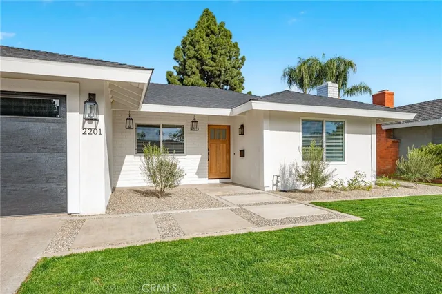 a front view of a house with a yard outdoor seating and yard