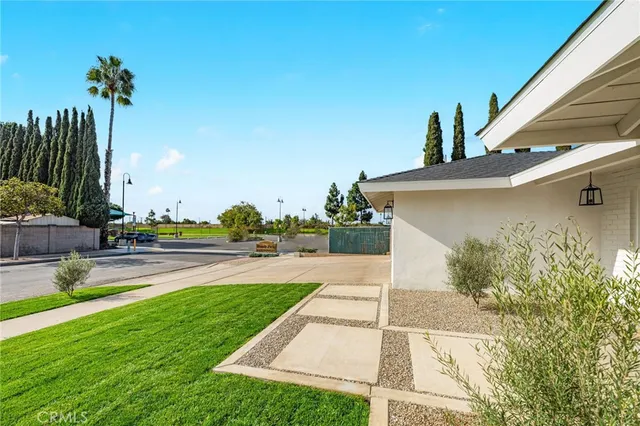 a view of a patio with a table and chairs
