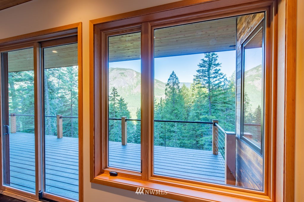 39 Bitterbrush Road Winthrop, WA 98862 - Photo 13 of 40 a view of a balcony with floor to ceiling windows with wooden floor