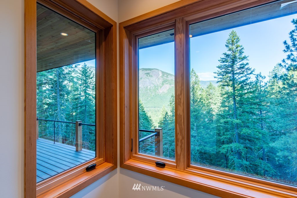 39 Bitterbrush Road Winthrop, WA 98862 - Photo 20 of 40 a view of a room with wooden floor and floor to ceiling window