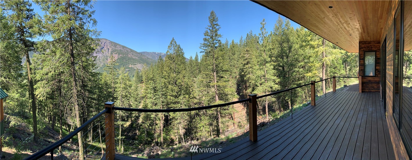 39 Bitterbrush Road Winthrop, WA 98862 - Photo 29 of 40 a view of a balcony with wooden floor and fence