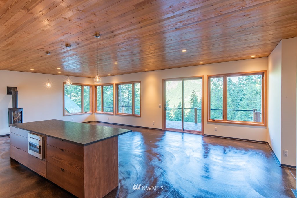 39 Bitterbrush Road Winthrop, WA 98862 - Photo 8 of 40 a living room with stainless steel appliances granite countertop furniture and a wooden floor