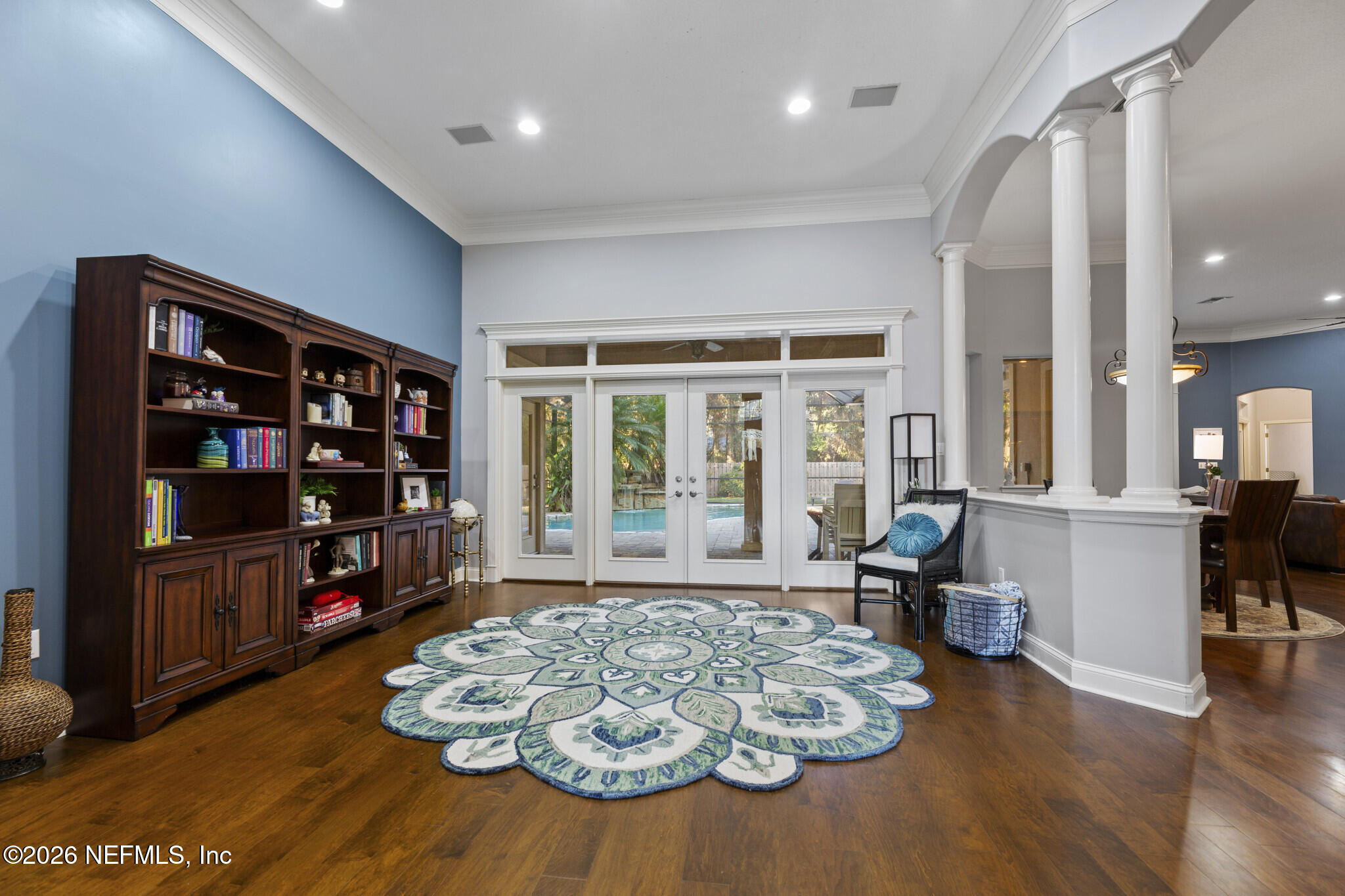 1478 Kathleen Way Fleming Island, FL 32003 - Photo 13 of 35 a living room with furniture hard wood floor and a bookshelf