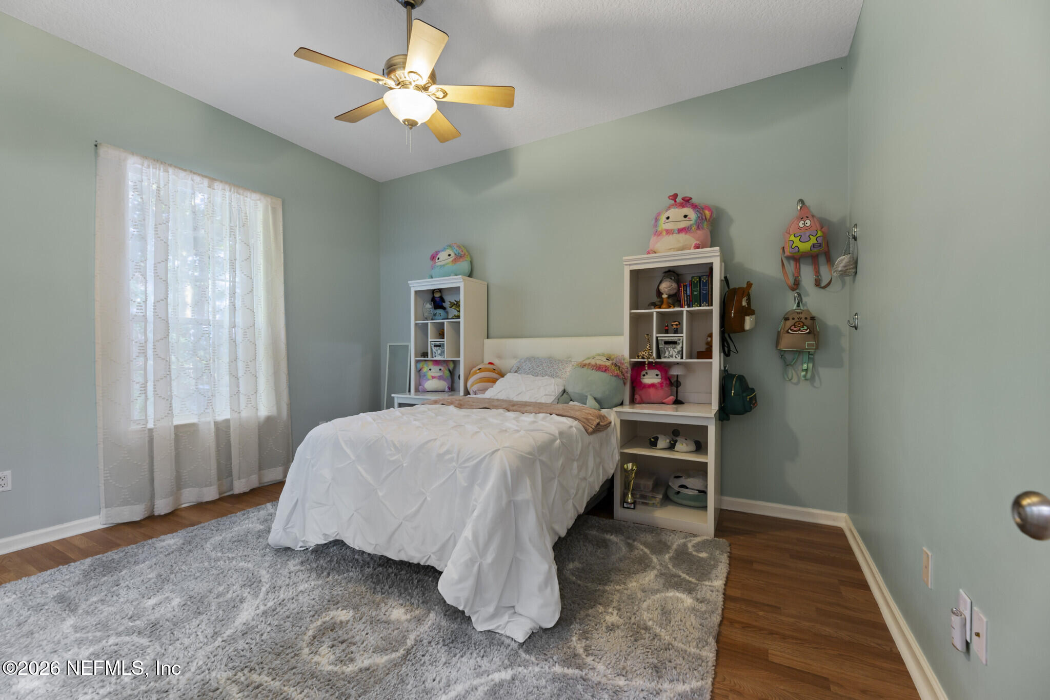 1478 Kathleen Way Fleming Island, FL 32003 - Photo 19 of 35 a bed room with a bed and a window