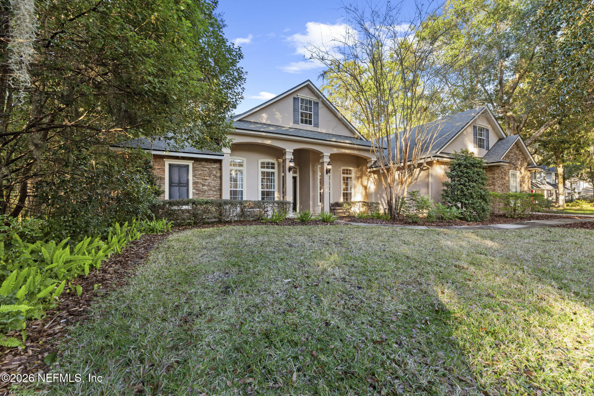 1478 Kathleen Way Fleming Island, FL 32003 - Photo 3 of 35 a front view of a house with a yard