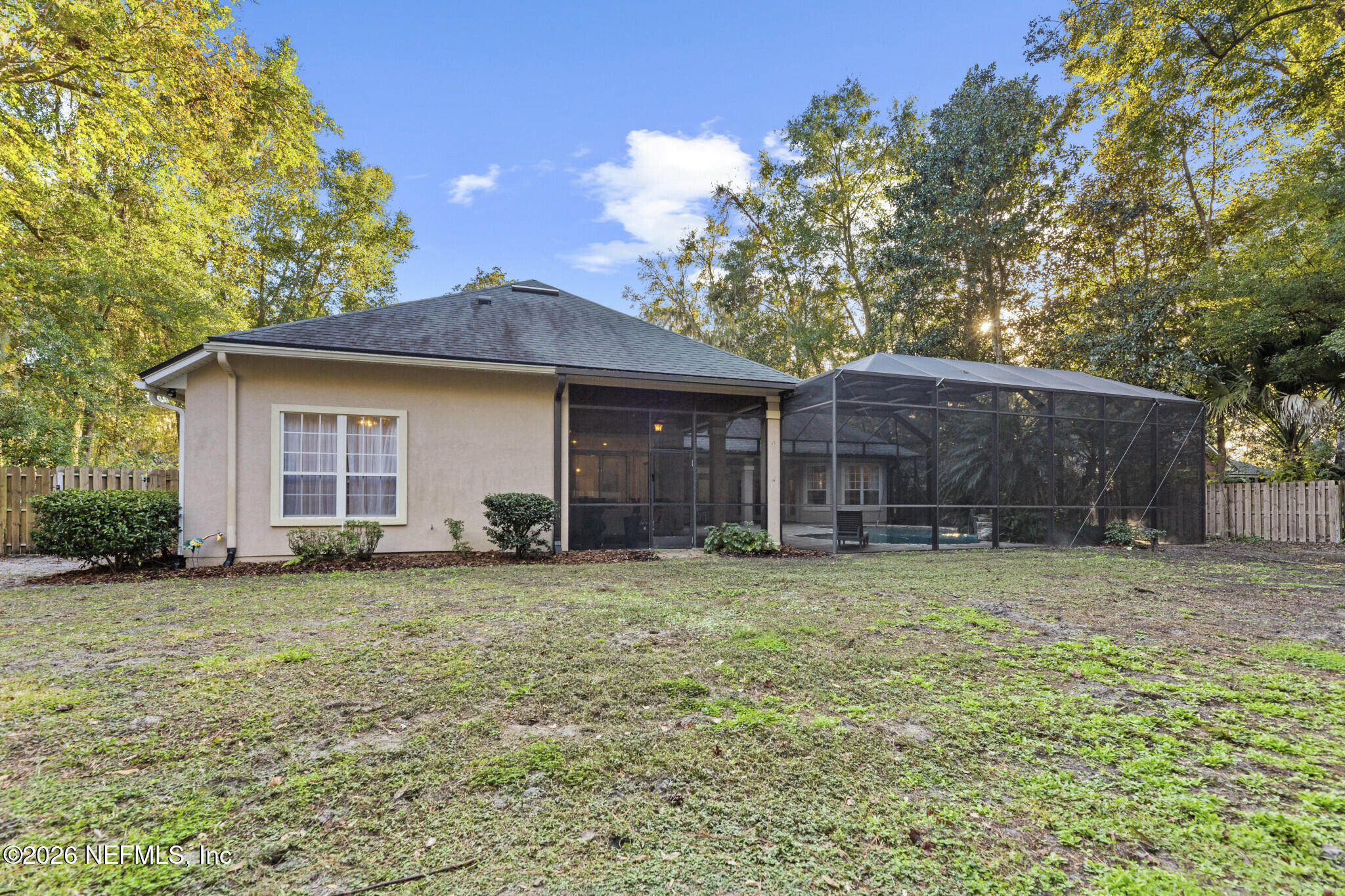 1478 Kathleen Way Fleming Island, FL 32003 - Photo 33 of 35 a house that has a tree in front of it