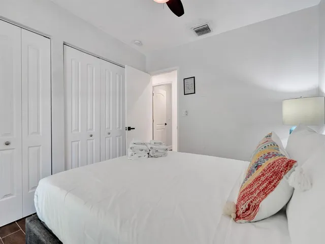 a view of staircase with white walls and a window