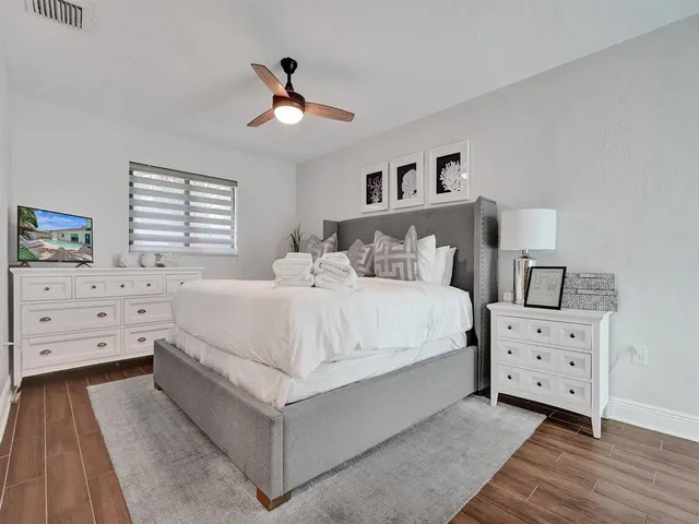 a picture of a glass door with a potted plant on a table