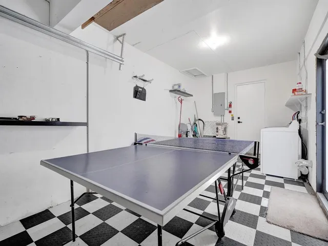 a view of a house with couches and swimming pool