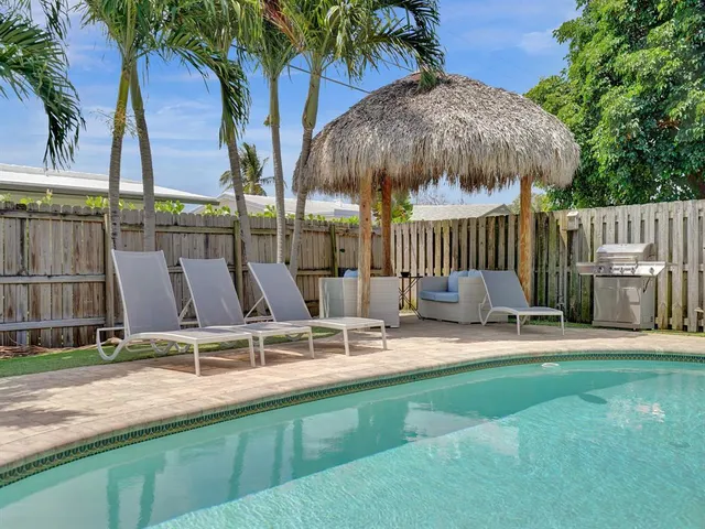 a view of a chair and table in the patio