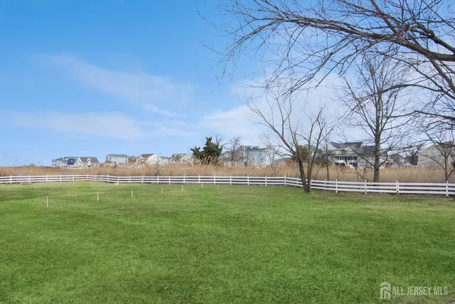 a backyard of a house with lots of green space and fog