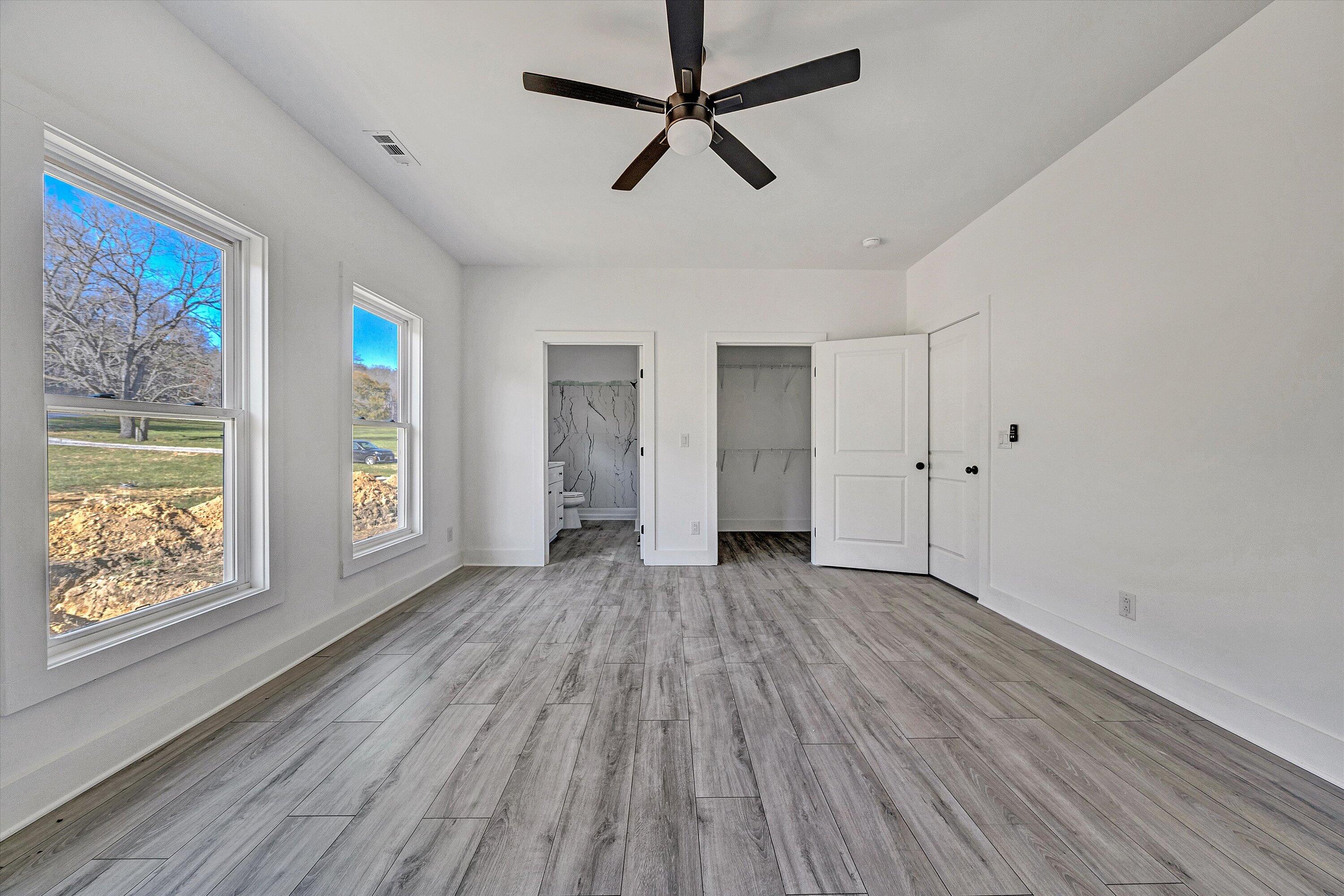 3086 Haymakertown Road Troutville, VA 24175 - Photo 12 of 16 a view of empty room with wooden floor and fan