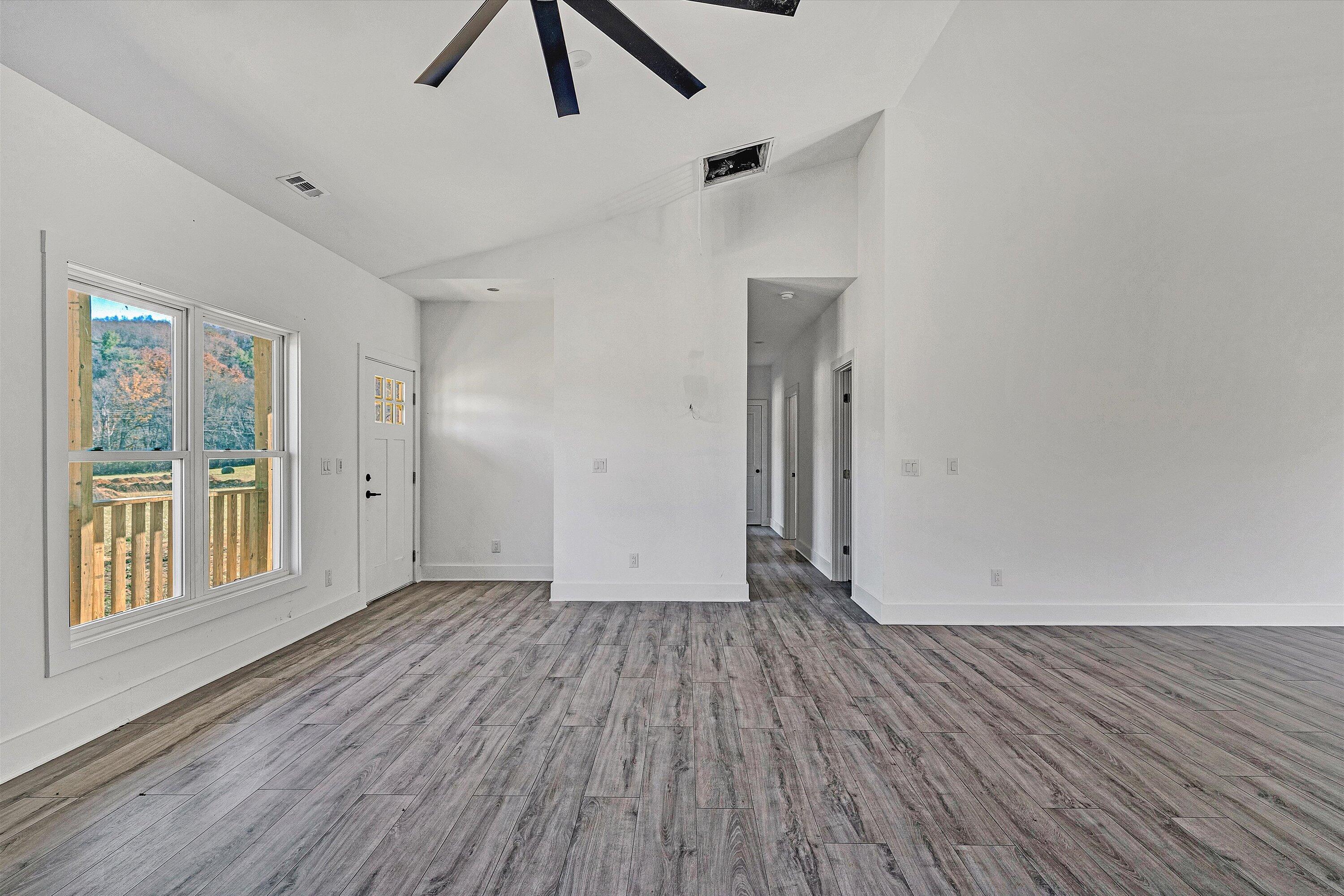 3086 Haymakertown Road Troutville, VA 24175 - Photo 4 of 16 wooden floor in an empty room with a window