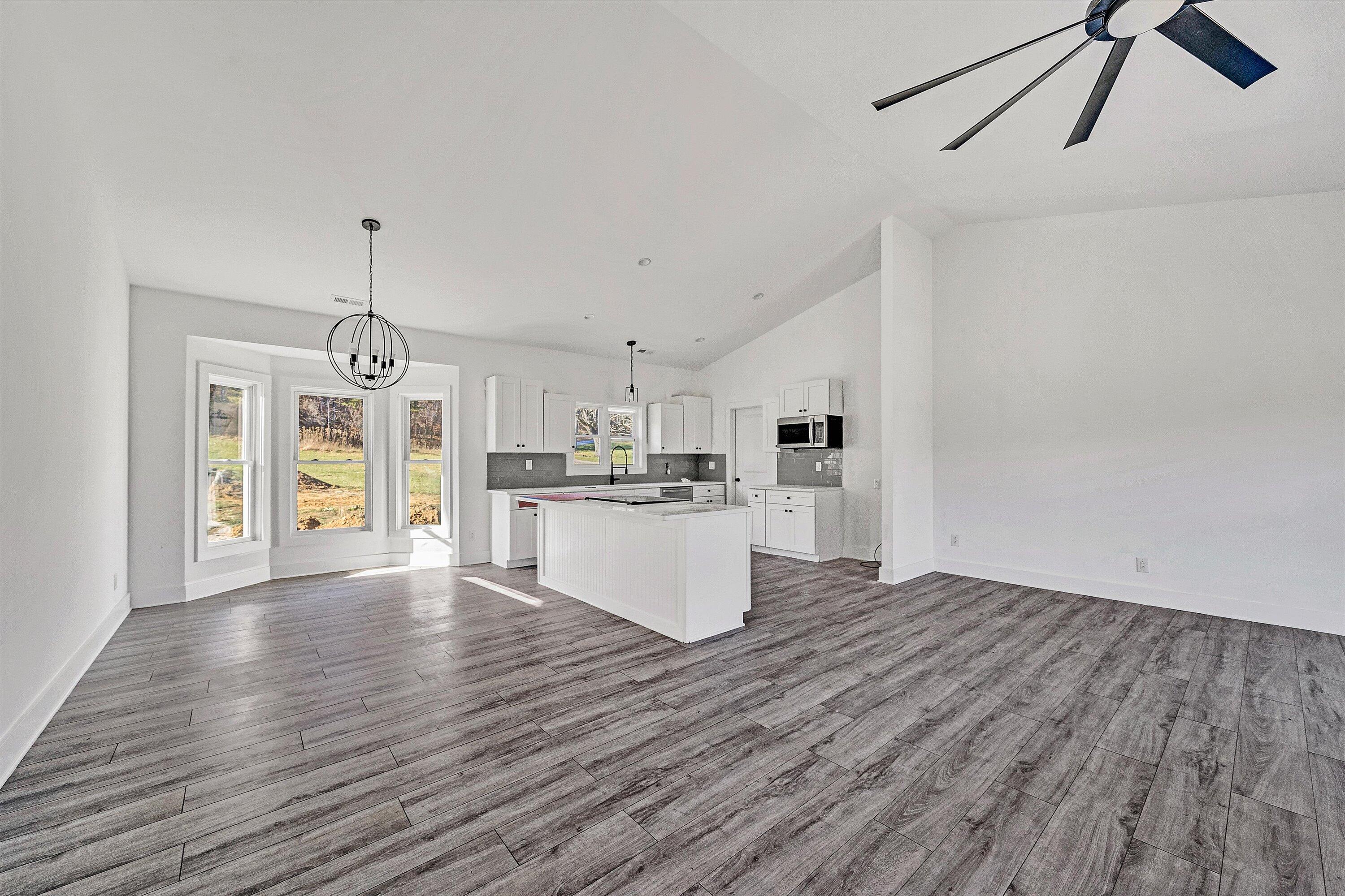 3086 Haymakertown Road Troutville, VA 24175 - Photo 5 of 16 a view of kitchen and hall with wooden floor