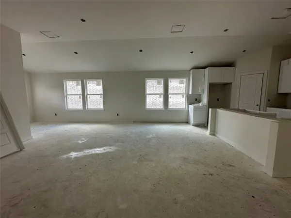 a view of a kitchen with a sink and dishwasher cabinets