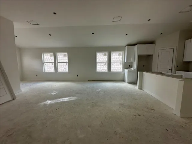 a view of a kitchen with a sink and dishwasher cabinets