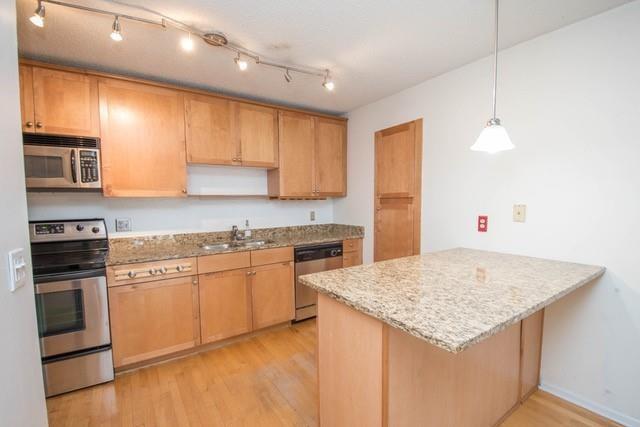 2657 Lenox Road Northeast, Unit 122 Atlanta, GA 30324 - Photo 1 of 1 a kitchen with stainless steel appliances granite countertop a sink stove and refrigerator