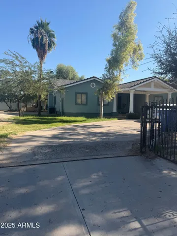 a view of a house with a yard and entertaining space