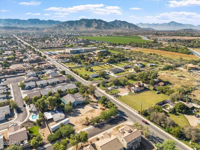 an aerial view of residential houses with outdoor space