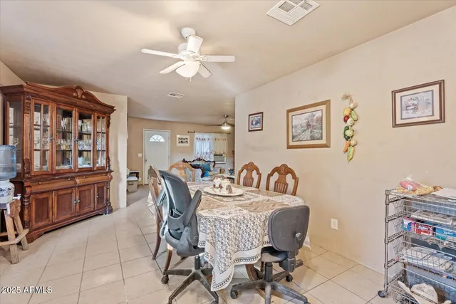 a bedroom with furniture and a flat screen tv