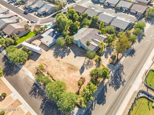 an aerial view of residential houses with outdoor space