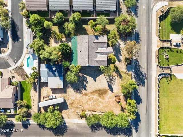 a building exterior with furniture and windows