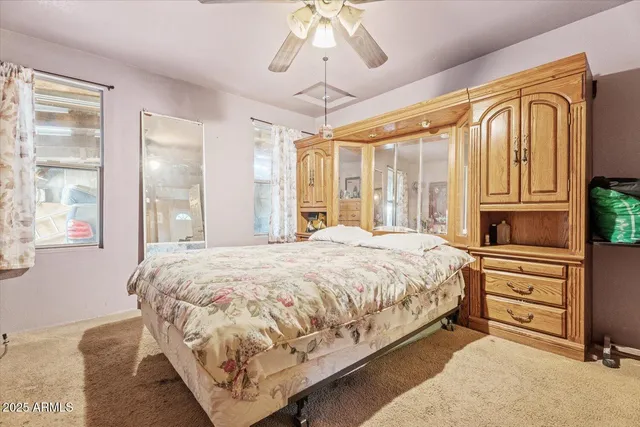 a bathroom with a sink mirror and toilet