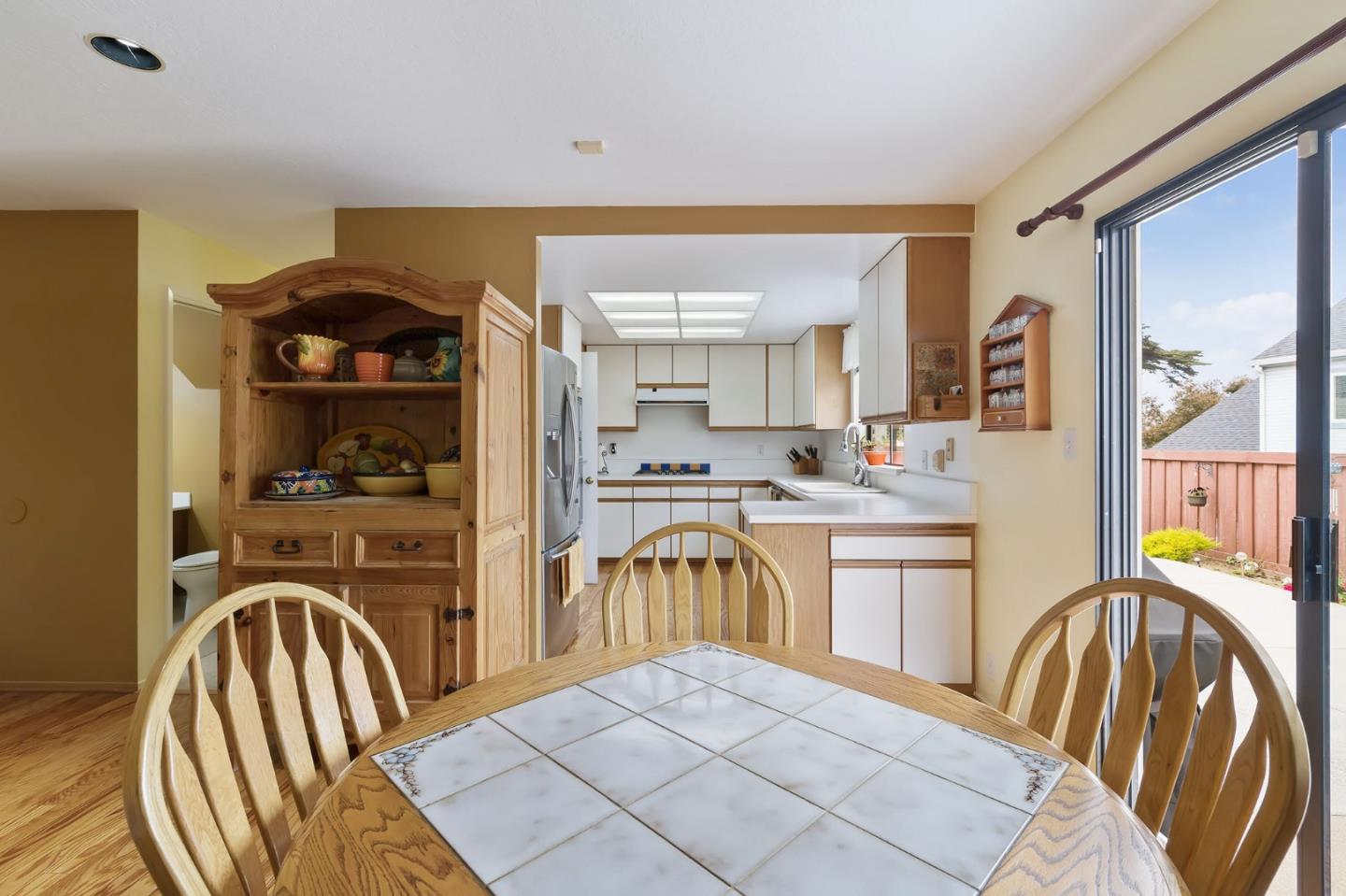 360 Winwood Avenue Pacifica, CA 94044 - Photo 12 of 26 a kitchen with stainless steel appliances granite countertop a sink and a refrigerator
