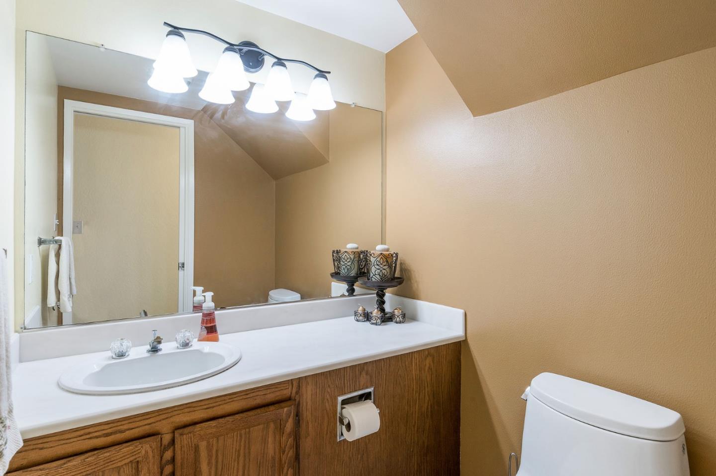 360 Winwood Avenue Pacifica, CA 94044 - Photo 17 of 26 a bathroom with a sink vanity and a mirror