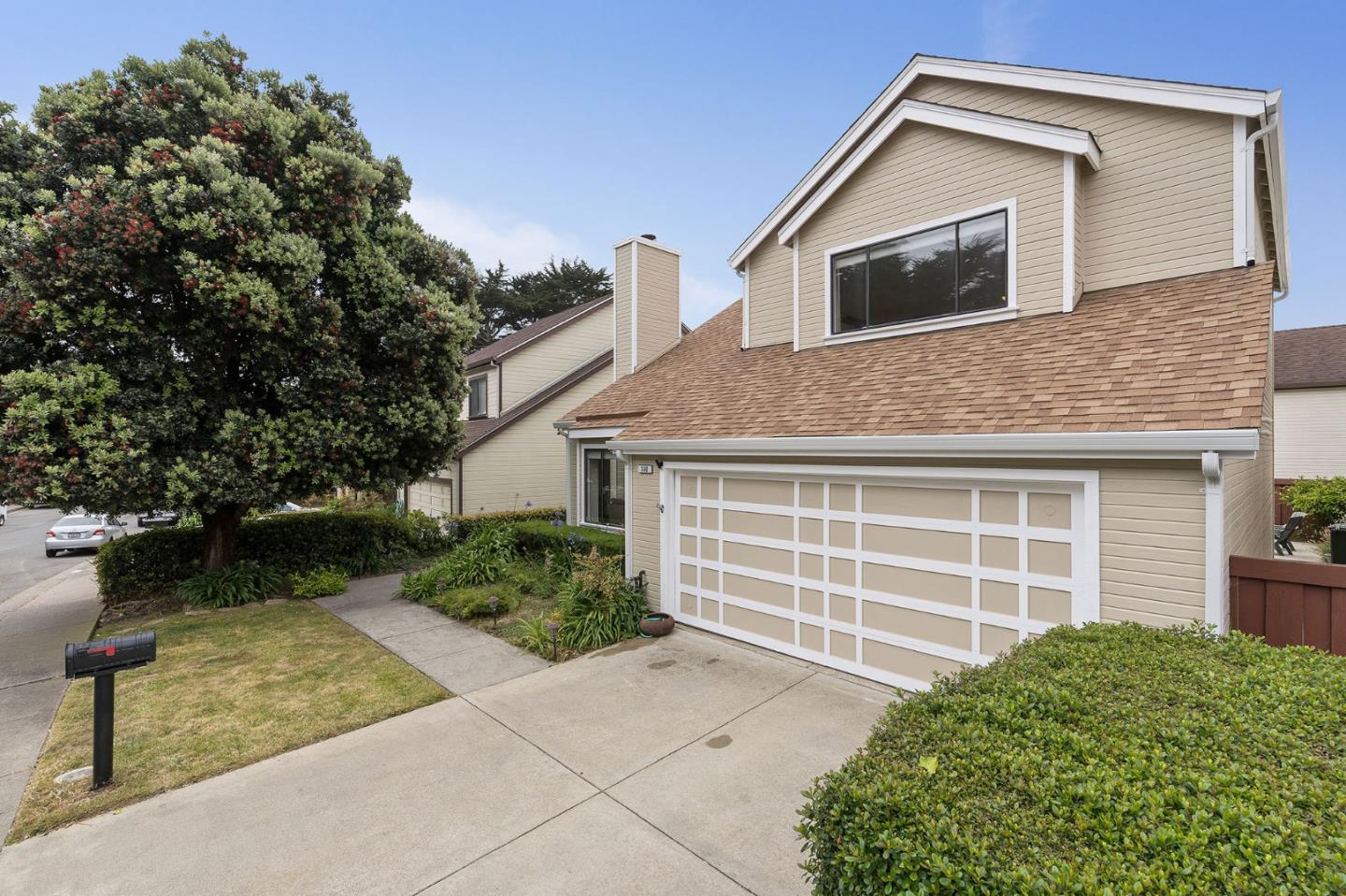 360 Winwood Avenue Pacifica, CA 94044 - Photo 2 of 26 a front view of a house with a garden