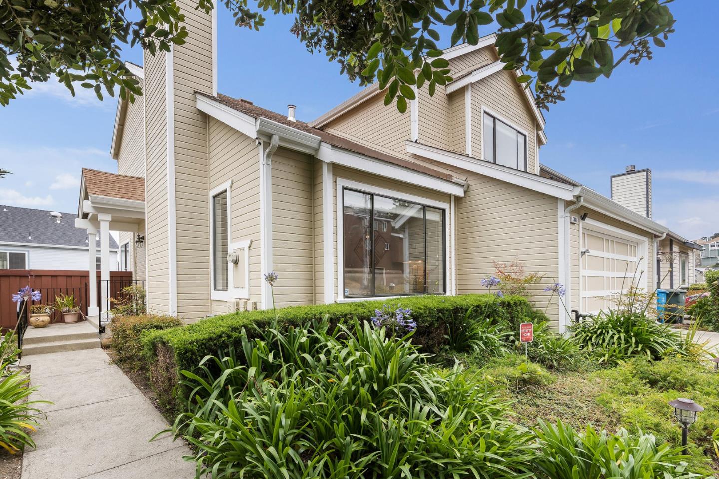 360 Winwood Avenue Pacifica, CA 94044 - Photo 3 of 26 front view of a house with a garden