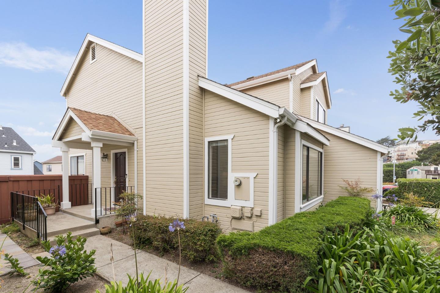 360 Winwood Avenue Pacifica, CA 94044 - Photo 4 of 26 a view of a white house next to a yard