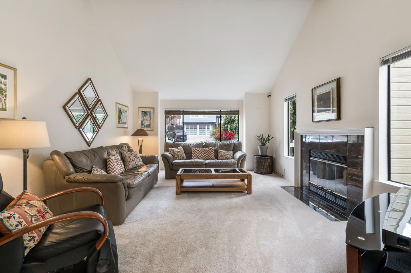 360 Winwood Avenue Pacifica, CA 94044 - Photo 5 of 26 a living room with furniture and a fireplace