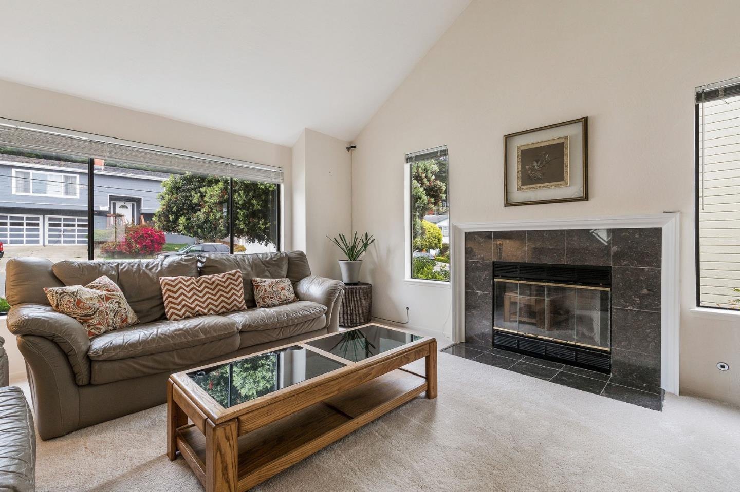 360 Winwood Avenue Pacifica, CA 94044 - Photo 6 of 26 a living room with furniture and a fireplace