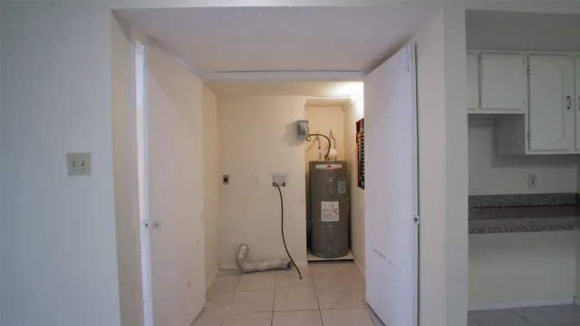 a view of a hallway with a dining room