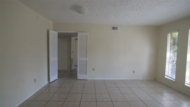 a view of an empty room with window