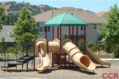 15 Chamiso Drive Los Alamos, CA 93440 - Photo 15 of 15 a backyard of a house with table and chairs