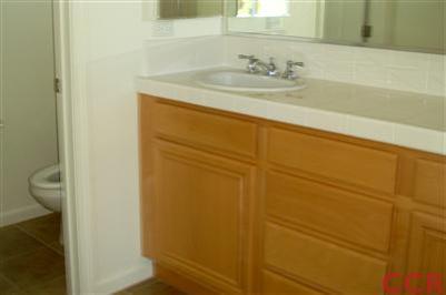 15 Chamiso Drive Los Alamos, CA 93440 - Photo 8 of 15 a bathroom with a sink and a mirror