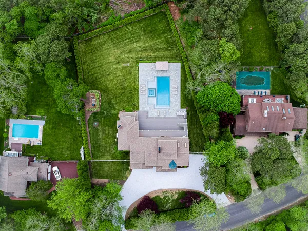 an aerial view of a house with a garden