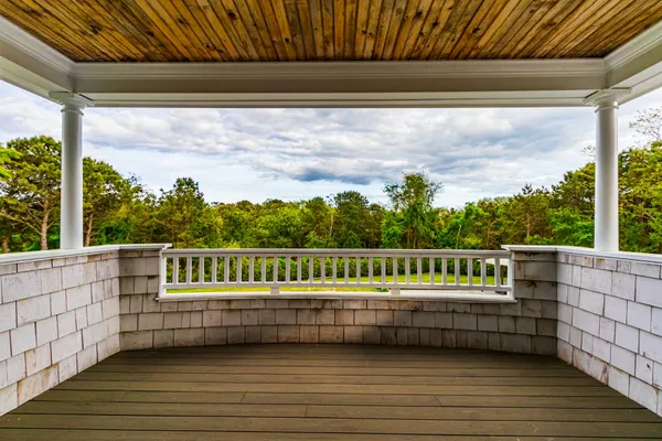 a white bath tub sitting in a bathroom next to a toilet